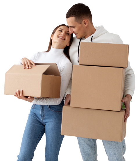 Pareja cargando cajas de mudanza en su nueva vivienda
